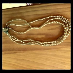 Faux pearl necklace, rhinestone clasp.